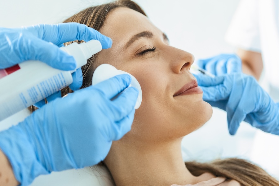 woman getting botox for TMJ at the dentist